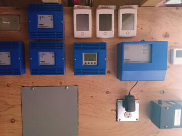 Tekmar control system for a radiant floors heated by an air to water heat pump. Remote thermostats with temperature sensors in drywall.